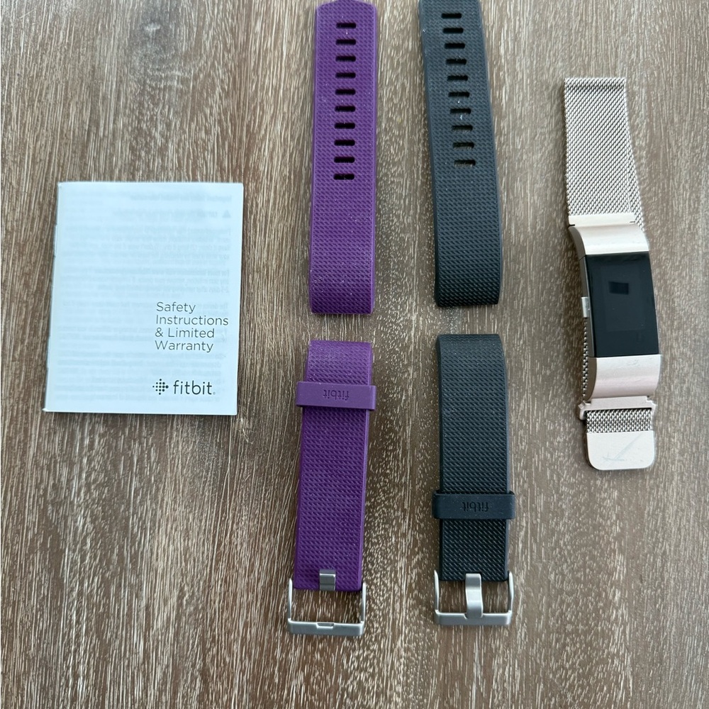 Fitbit Smartwatch with Purple, Black, and Rose Gold Bands